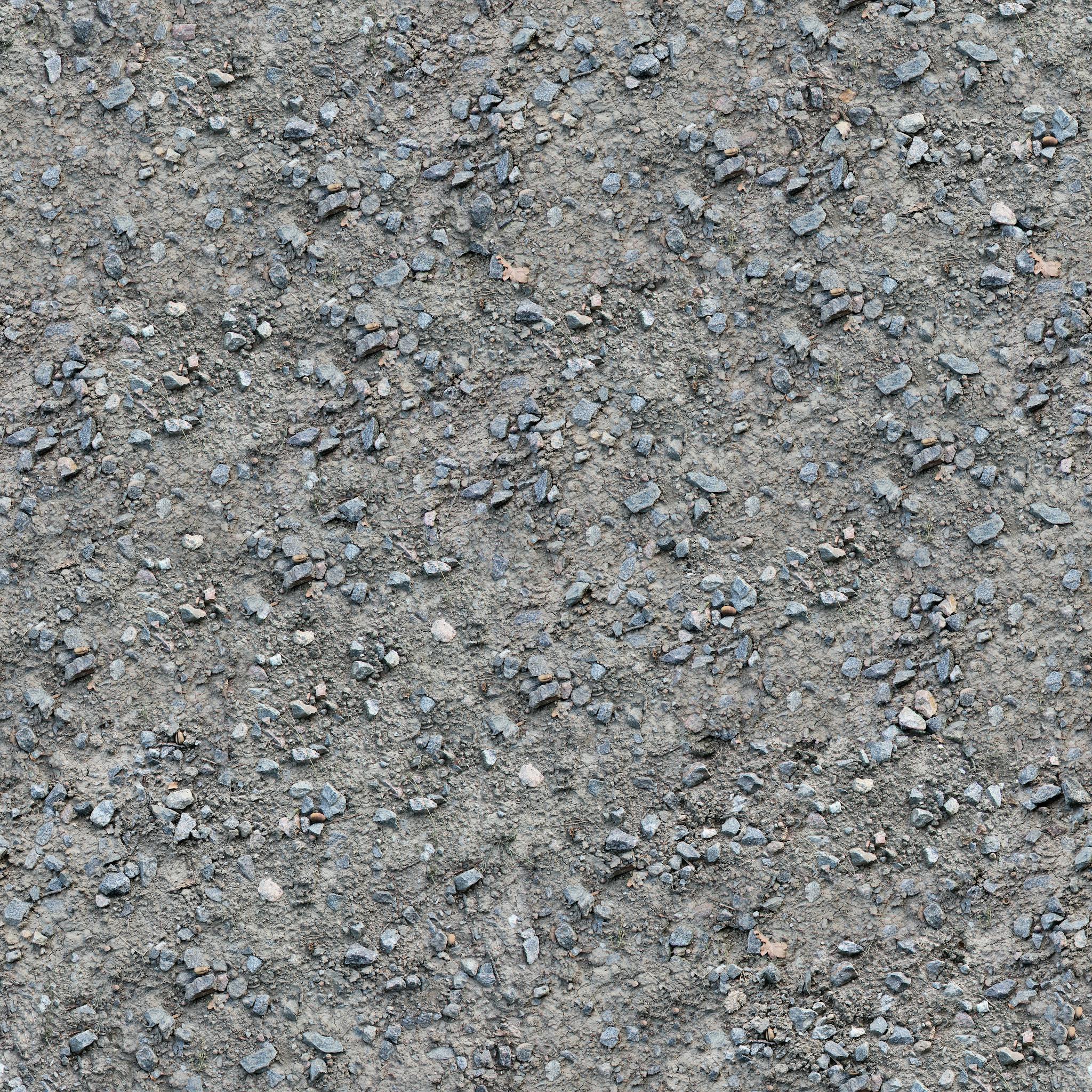 Close-up of a gravel and concrete textured surface, ideal for backgrounds.